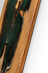 Exclusive handmade table of solid wood and epoxy resin on the background of wood boards