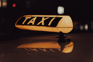 taxi sign on a cab at night