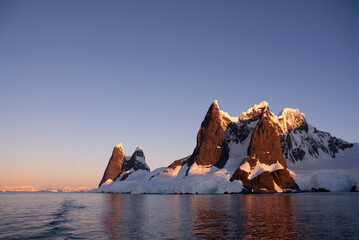 Lemaire strait coastal landscape, mountains and icebergs, Antarctic Peninsula, Antartica.