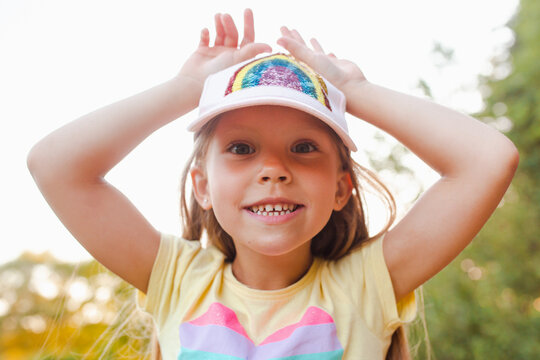 Happy little girl runing and jumping on nature outdoor