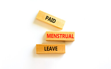 Paid menstrual leave symbol. Concept words Paid menstrual leave on wooden blocks. Beautiful white table white background. Business medical paid menstrual leave concept. Copy space.