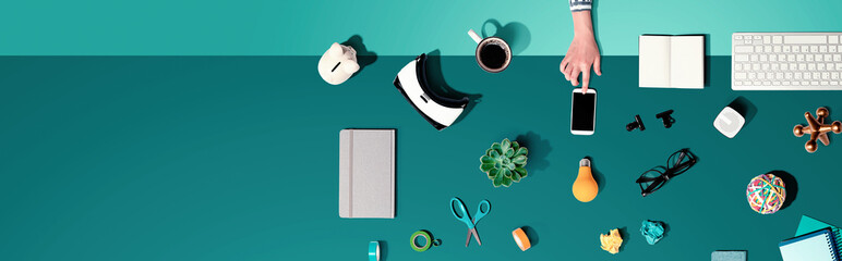 Collection of electronic gadgets and office supplies - flat lay