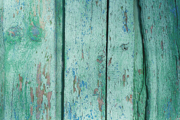 Texture of old wood with cracked paint in blue and green colours