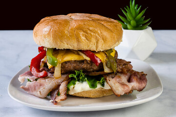 bacon cheese burger  top with onions and peppers