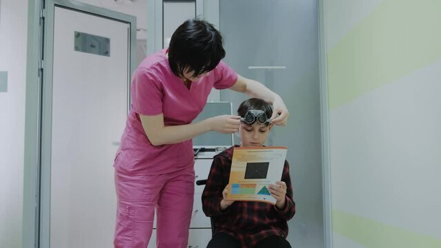 Doctor checking and examination on eye with little boy child in hospital.healthcare and medicine