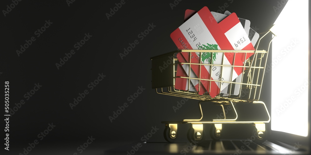 Poster bank card mockups with flags of lebanon in a small shopping cart on the computer. conceptual 3d rend