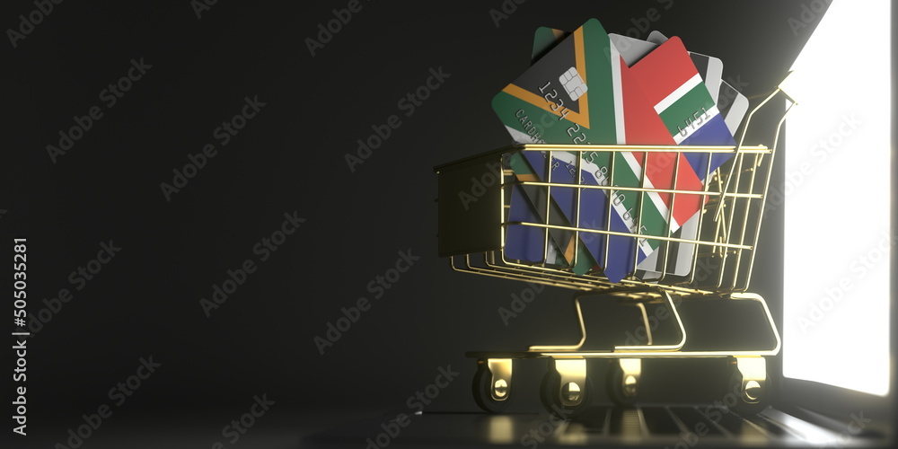 Aufkleber credit card mockups with flags of south africa in a small shopping cart on the computer. conceptual 
