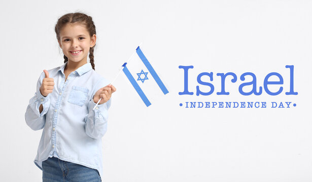 Little girl with flag and text ISRAEL INDEPENDENCE DAY on light background