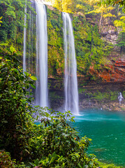 Impressive Misol-ha waterfall with turquoise water.
