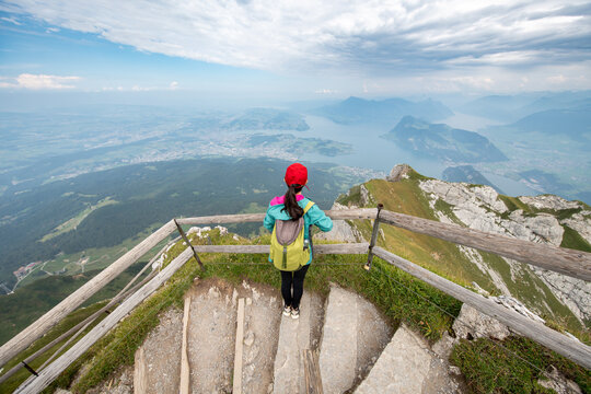 Young woman enjoying her view from top of Pilatus mountain, Lucerne, Switzerland
