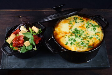 rice cooker with pork sausage roast potato salad and cheese, herb sauce restaurant food, brazilian food