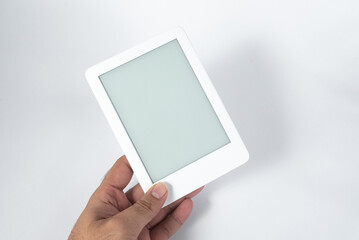 Ebook reader over isolated white background - being held by a male hand