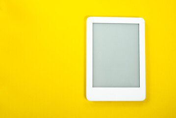 Ebook reader over yellow background