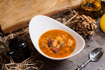 Spicy New Orleans Gumbo soup with shrimp, vegetables and hunting sausages
