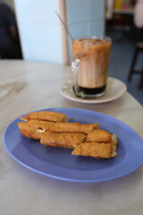 Local tea time snack, you tiao with kaya and butter with Three layers milk tea