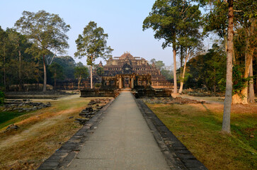 Angkor Wat temple complex, Cambodia. Beautiful view of  ruins of ancient temple of Baphuon, next to elephant terraces
