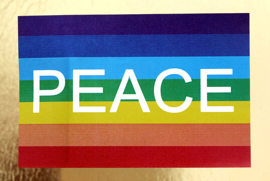 Rainbow flag with text PEACE