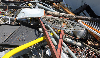 scrap metal and rusty ferrous waste in a landfill for recyclable materials - obrazy, fototapety, plakaty