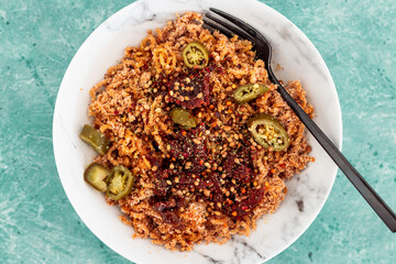healthy plant-based food, vegan spaghetti noodles with sundried tomatoes and jalapeno peppers