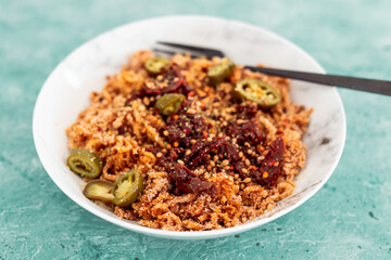 healthy plant-based food, vegan spaghetti noodles with sundried tomatoes and jalapeno peppers