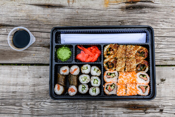 Set of the different sushi on wooden table. Top view