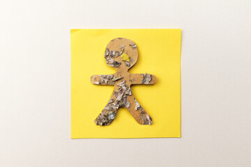 Recycled paper person cutout; environmental theory