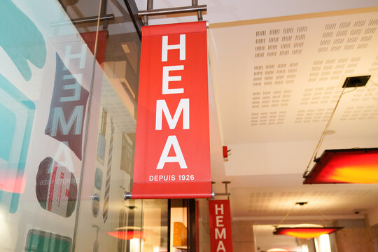 hema shop brand sign red logo text store entrance boutique in street