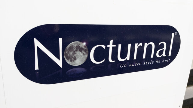 nocturnal sign text and brand logo shop of manufacturer seller for mattresses and pillows store