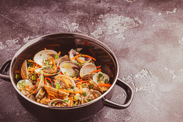 Shells vongole venus clams with vegetables and herbs