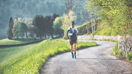 Obraz premium Man practices Nordic walking over long distances
