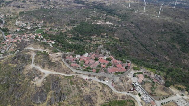 Orbiting shot of ancient hilltop fortified village of Sortelha, Portugal. Aerial view