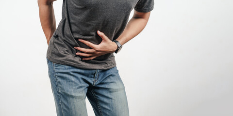 Young man holding his stomach and bottom suffering from Diarrhea, incontinence, prostatitis,...