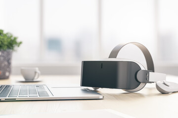 Obraz na płótnie Canvas Virtual reality and metaverse concept with modern VR helmet, joystick and laptop on wooden table. 3D rendering