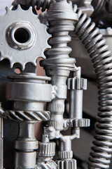 Metal parts, gears, springs and mechanisms close-up.