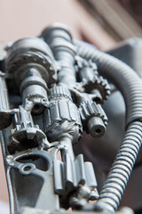 Metal parts, gears, springs and mechanisms close-up.