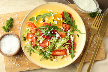 Concept of tasty food, salad with red orange, top view