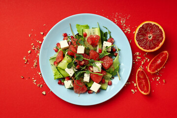 Concept of tasty food, salad with red orange, top view