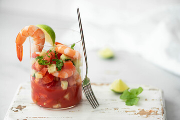 fresh shrimp cocktail with tomato sauce and lime