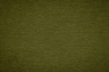Texture of dark green and olive colors paper background, macro. Structure of dense khaki craft cardboard.