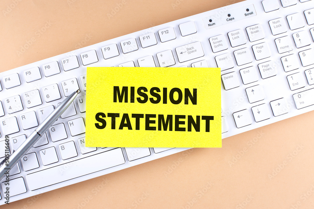 Poster text mission statement text on a sticky on keyboard, business concept