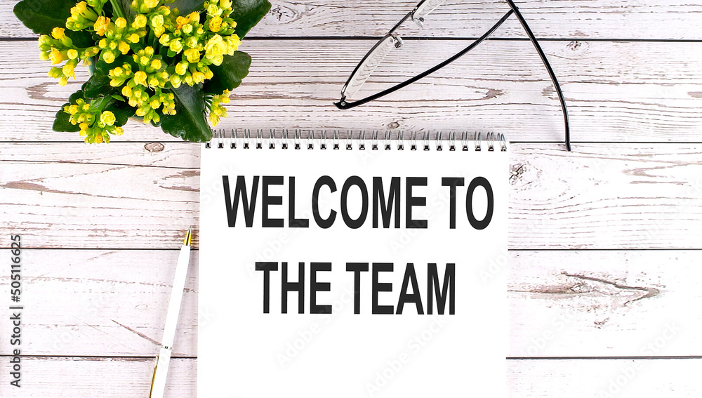 Poster welcome to team text concept write on notebook on wooden background