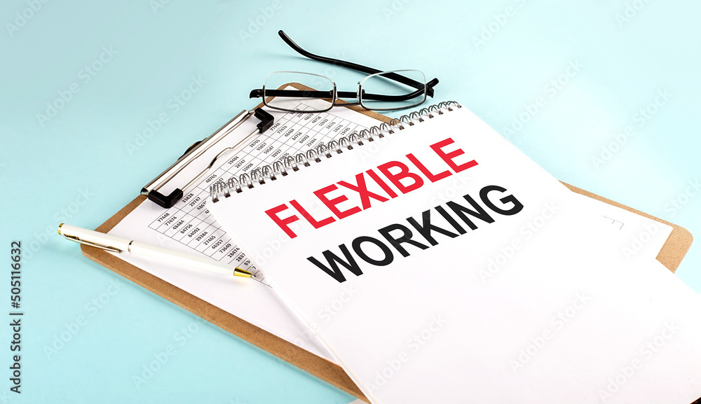 Poster flexible working text on notepad on clipboard with chart on blue background, concept closeup. busine