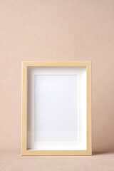 blank photo frame  at peach color background