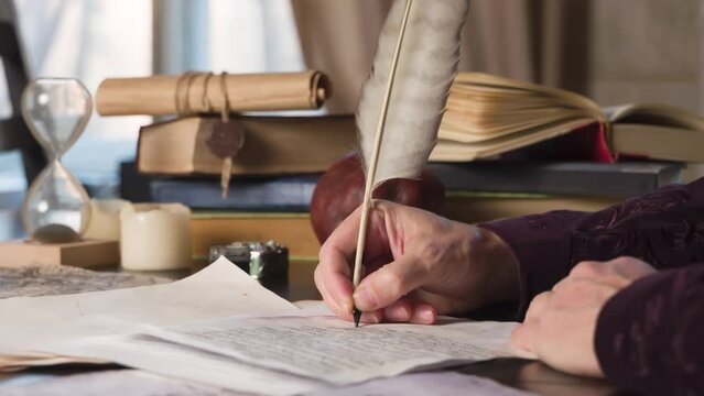 Medieval Writer Corrects the Text. Medieval writer rereads text on a sheet of old paper and appends with a pen at the bottom a few lines