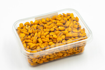 Packed gravy corn nuts on a white background. Close-up. local name soslu mısır