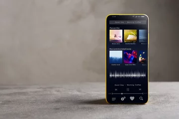 Tuinposter Streaming service. Listen music online concept online music player app on smartphone © Sensay