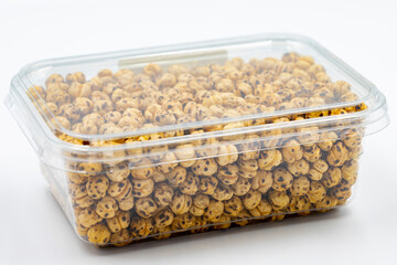Packaged roasted chickpeas on a white background. Close-up. local name leblebi
