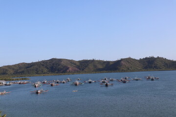 fishing boats looking for fish in mandeh