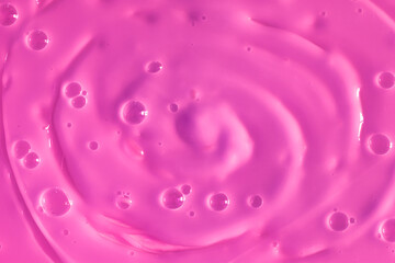 Bubble purple background texture. Berry gel to cleanse the skin of the face and body. Spa treatments, skin care. Bath foam, detergent. Slime pink.