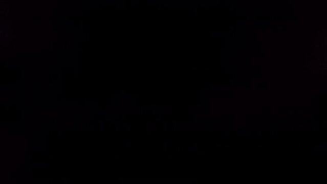 Flying of Pomegranate in Black Background in Slow Motion